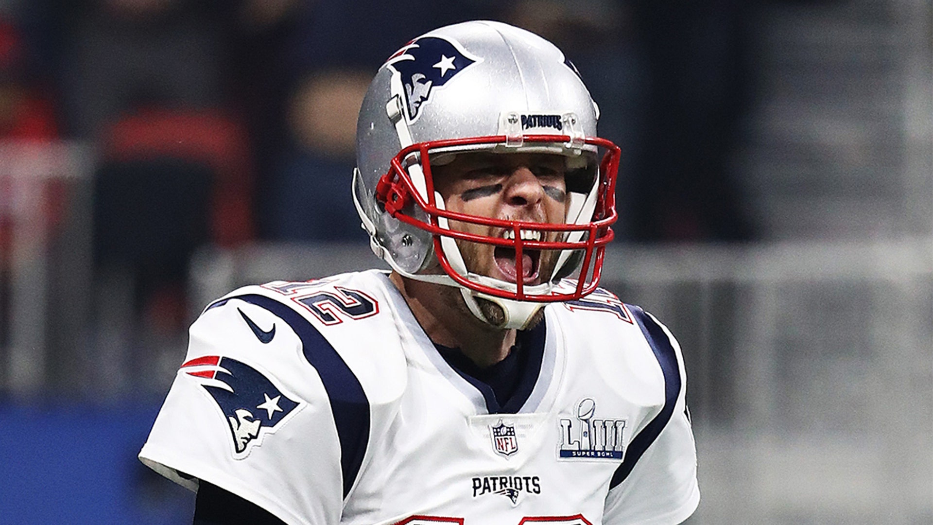 Tom Brady #12 of the New England Patriots celebrates his teams fourth quarter touchdown against the Los Angeles Rams during Super Bowl LIII at Mercedes-Benz Stadium on February 03, 2019 in Atlanta, Georgia.