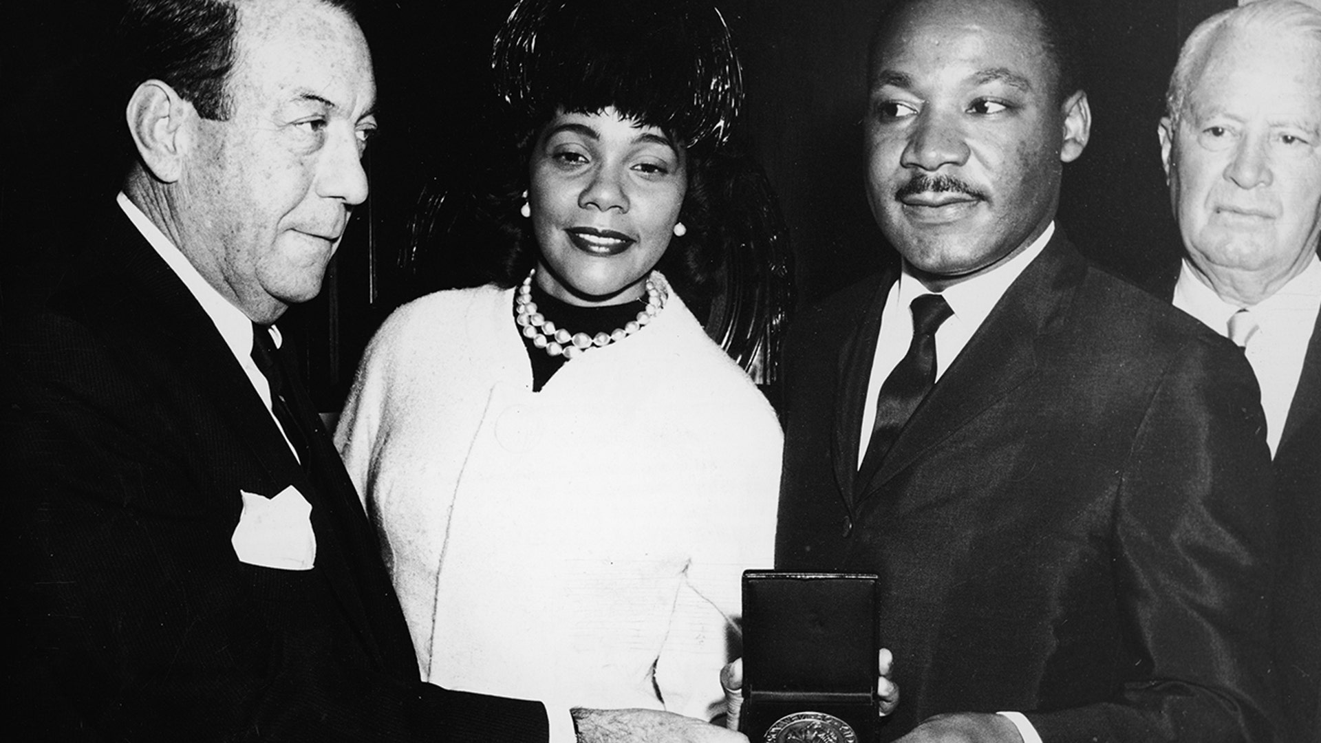 American civil rights leader Dr. Martin Luther King Jr. stands with his wife, Coretta, and New York City Mayor Robert F. Wagner as he is presented with the Medal of Honor of the City of NY, New York City, Dec. 18, 1964. 