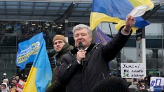 Former Ukraine president Poroshenko returns to face treason charges