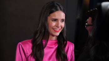 Nina Dobrev trades winter gear for red-hot bikini as she enjoys snow day