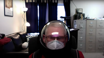 Michigan professor wearing space helmet tells students they are 'vectors of disease' in Zoom rant