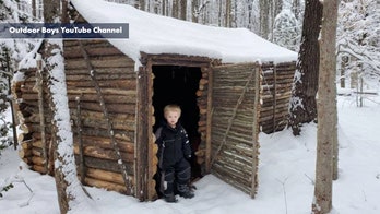 Virginia father spends year camping, building log cabin 'survival shelter' with three young sons