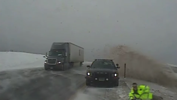 Wyoming trooper dives out of the way of SUV careening toward him in icy conditions, video shows