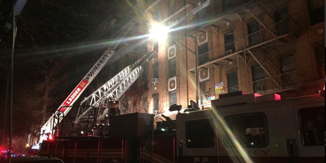 New York Fire Department ladder trucks deploy at a building fire in the Bronx borough of New York City, New York, U.S. December 28, 2017. (NYFD/Handout via REUTERS)