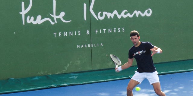Serbian tennis player Novak Djokovic trains at Puente Romano Tennis Club in Marbella, Spain, Jan. 2, 2022.