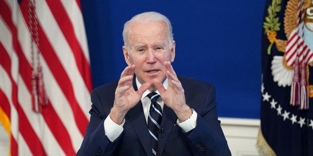 FILE PHOTO: U.S. President Joe Biden delivers remarks on the administration's coronavirus disease (COVID-19) surge response in the South Court Auditorium at the White House in Washington, U.S., January 13, 2022. 