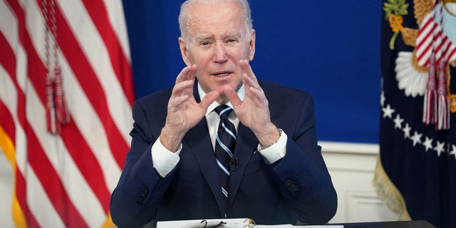 FILE PHOTO: U.S. President Joe Biden delivers remarks on the administration's coronavirus disease (COVID-19) surge response in the South Court Auditorium at the White House in Washington, U.S., January 13, 2022.