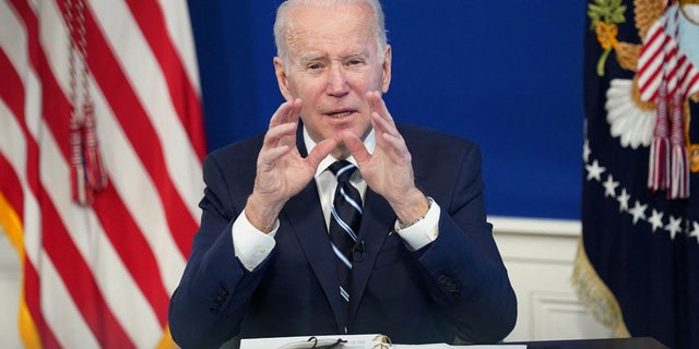 FILE PHOTO: U.S. President Joe Biden delivers remarks on the administration's coronavirus disease (COVID-19) surge response in the South Court Auditorium at the White House in Washington, U.S., January 13, 2022. 