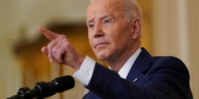 U.S. President Joe Biden holds a formal news conference in the East Room of the White House, in Washington, D.C., U.S., January 19, 2022. REUTERS/Kevin Lamarque