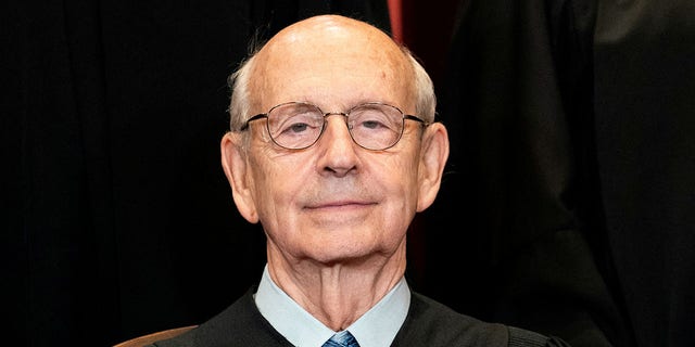 Associate Justice Stephen Breyer poses during a group photo of the justices at the Supreme Court in Washington, April 23, 2021. 