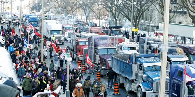 Trucks sit parked on Wellington Street near the Parliament Buildings as truckers and their supporters take part in a convoy to protest COVID-19 vaccine mandates for cross-border truck drivers in Ottawa, Ontario, Canada, Jan. 29, 2022.