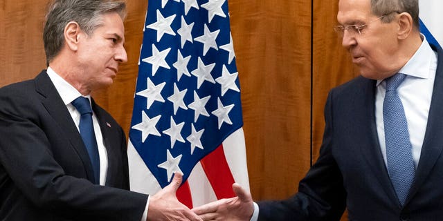 Secretary of State Antony Blinken greets Russian Foreign Minister Sergei Lavrov before their meeting, Friday, Jan. 21, 2022, in Geneva, Switzerland. (AP Photo/Alex Brandon, Pool)