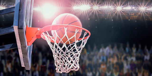 basketball scoring during match in arena