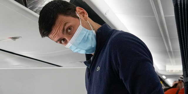 Novak Djokovic prepares to take his seat on a plane to Belgrade, in Dubai, United Arab Emirates, Jan. 17, 2022.