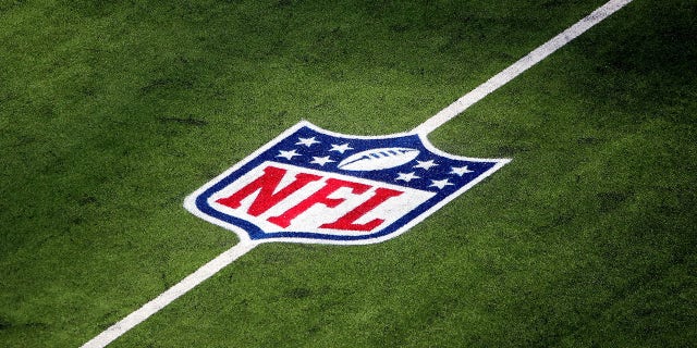 An NFL logo is seen on the field at SoFi Stadium in Inglewood, California, before a game between the Arizona Cardinals and the Los Angeles Rams, Oct. 3, 2021.