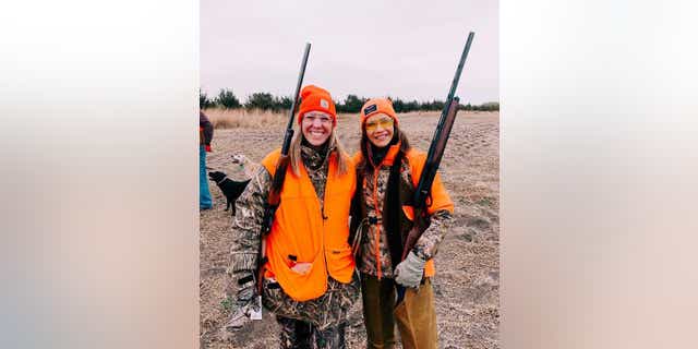 Caroline Thorman Woods in a photo with her former boss, Gov. Kristi Noem, while they were pheasant hunting in South Dakota, October 2020.