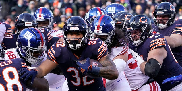 Chicago Bears running back David Montgomery heads to the end zone for a touchdown during the first half of an NFL football game against the New York Giants Sunday, Jan. 2, 2022, in Chicago.