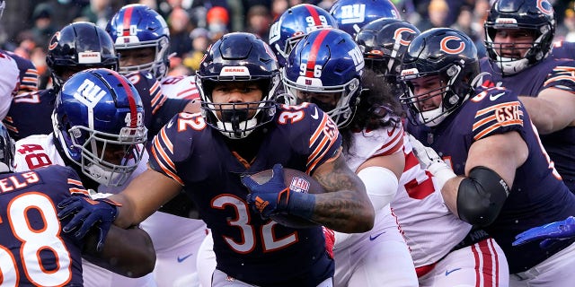 Chicago Bears running back David Montgomery heads to the end zone for a touchdown during the first half of an NFL football game against the New York Giants Sunday, Jan. 2, 2022, in Chicago.