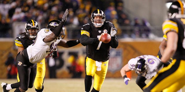 FILE - Pittsburgh Steelers' Ben Roethlisberger shovel passes the ball while being hit by Baltimore Ravens' Trevor Pryce during the second quarter of the NFL AFC championship football game in Pittsburgh, Sunday, Jan. 18, 2009.  Roethlisberger will run out onto the Heinz Field turf for the 135th and likely final time on Monday, Jan. 3, 2022, when the Steelers host Cleveland.