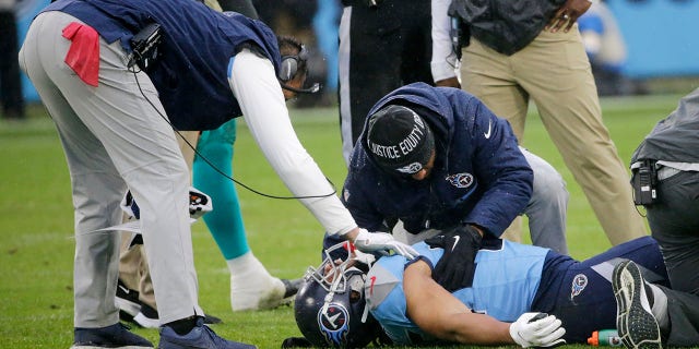 Tennessee Titans tight end MyCole Pruitt is attended to after being injured in the first half of an NFL football game against the Miami Dolphins Sunday, Jan. 2, 2022, a Nashville, Tenn.