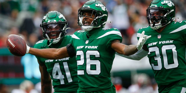 New York Jets' Brandin Echols celebrates his interception during the first half of an NFL football game against the Tampa Bay Buccaneers, Sunday, Jan. 2, 2022, in East Rutherford, New Jersey.