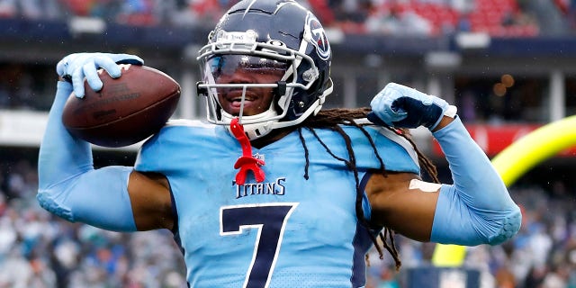 Tennessee Titans running back D'Onta Foreman celebrates after scoring a touchdown on a 21-yard run against the Miami Dolphins in the first half of an NFL football game Sunday, Jan.. 2, 2022, in Nashville, Tenn.