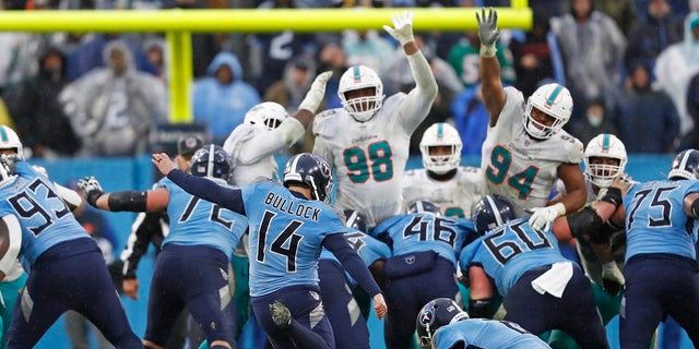 Tennessee Titans kicker Randy Bullock (14) boots a 44-yard field goal against the Miami Dolphins in the second half of an NFL football game Sunday, Jan. 2, 2022, in Nashville, Tenn. (AP Photo/Wade Payne)