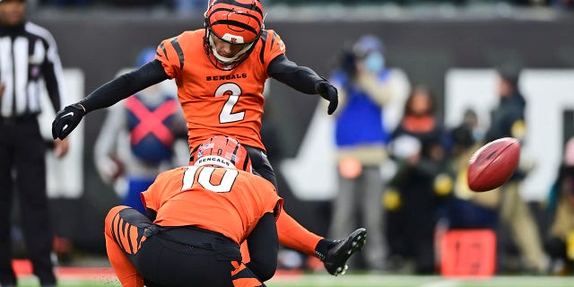 Cincinnati Bengals kicker Evan McPherson (2) boots a winning 20-yard field goal during the second half of an NFL football game against the Kansas City Chiefs, Sunday, Jan. 2, 2022, in Cincinnati.