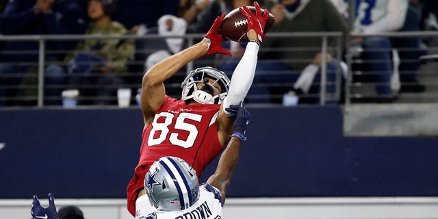 Arizona Cardinals wide receiver Antoine Wesley (85) catches a pass for a touchdown as Dallas Cowboys cornerback Anthony Brown (30) defends during the second half of an NFL football game Sunday, Jan. 2, 2022, in Arlington, Texas.