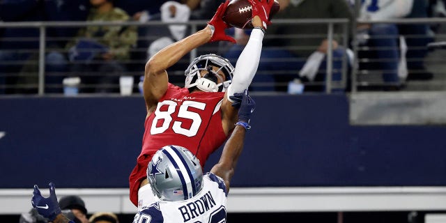 Arizona Cardinals wide receiver Antoine Wesley (85) catches a pass for a touchdown as Dallas Cowboys cornerback Anthony Brown (30) defends during the second half of an NFL football game Sunday, Jan. 2, 2022, in Arlington, Texas.