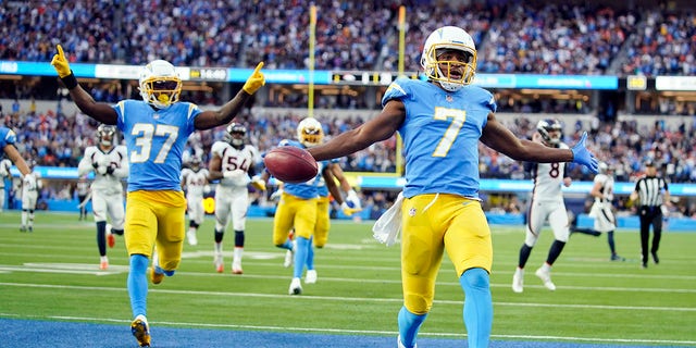 Los Angeles Chargers wide receiver Andre Roberts (7) returns a kick for a touchdown during the second half of an NFL football game against the Denver Broncos Sunday, Jan. 2, 2022, in Inglewood, Calif.