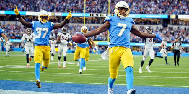Los Angeles Chargers wide receiver Andre Roberts (7) returns a kick for a touchdown during the second half of an NFL football game against the Denver Broncos Sunday, Jan. 2, 2022, in Inglewood, Calif.