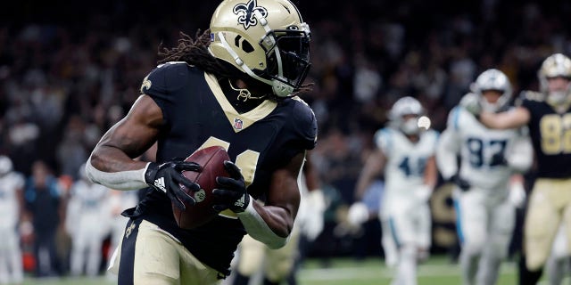New Orleans Saints running back Alvin Kamara (41) carries in the second half of a game against the Carolina Panthers in New Orleans Jan. 2, 2022.