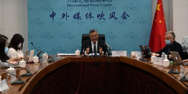 Fu Cong, center, the director general of the Foreign Ministry's arms control department, attends a press conference on nuclear arms control in Beijing, China, Tuesday, Jan. 4, 2022. The top Chinese arms control official denied Tuesday that his government is rapidly expanding its nuclear arsenal, though he said it is taking steps to ensure its nuclear deterrent remains viable in a changing security environment. (AP Photo/Ng Han Guan)