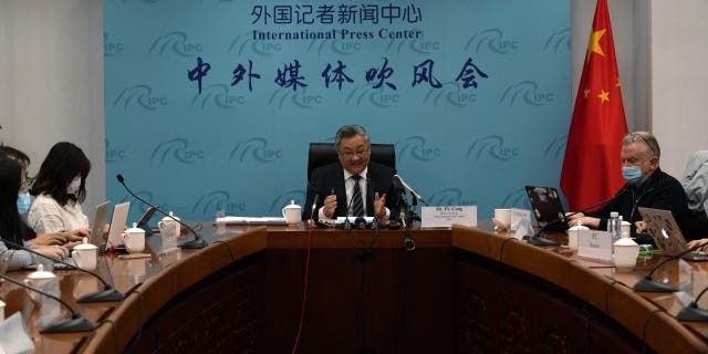 Fu Cong, center, the director general of the Foreign Ministry's arms control department, attends a press conference on nuclear arms control in Beijing, China, Tuesday, Jan. 4, 2022. The top Chinese arms control official denied Tuesday that his government is rapidly expanding its nuclear arsenal, though he said it is taking steps to ensure its nuclear deterrent remains viable in a changing security environment. (G3 Box News Photo/Ng Han Guan)