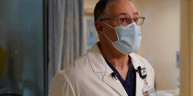 Edward Merrens, a chief clinical officer, is interviewed by The Associated Press, in the COVID-19 Intensive Care Unit at Dartmouth-Hitchcock Medical Center, in Lebanon, N.H., Monday, Jan. 3, 2022. (AP Photo/Steven Senne)