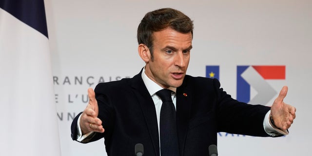 French President Emmanuel Macron speaks as he participates in a media conference with European Commission President Ursula von der Leyen after a meeting at the Elysee Palace in Paris, France, Friday, Jan. 7, 2022. (AP Photo/Michel Euler, Pool)