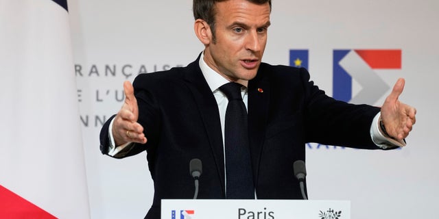French President Emmanuel Macron speaks as he participates in a media conference with European Commission President Ursula von der Leyen after a meeting at the Elysee Palace in Paris, France, Friday, Jan. 7, 2022. (AP Photo/Michel Euler, Pool)