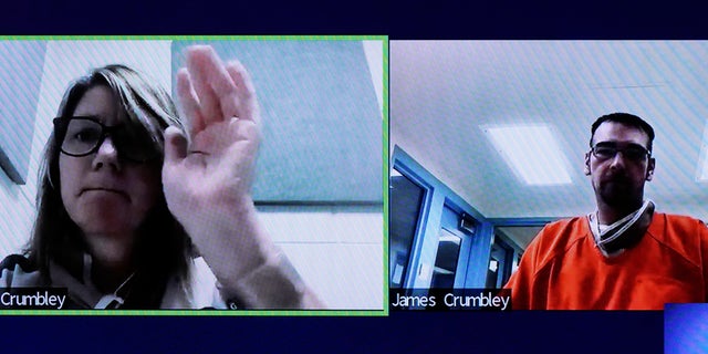 This image from court shows Jennifer Crumbley waving to her husband James during a Zoom hearing in Rochester Hills, Mich., Friday, Jan. 7, 2022. 