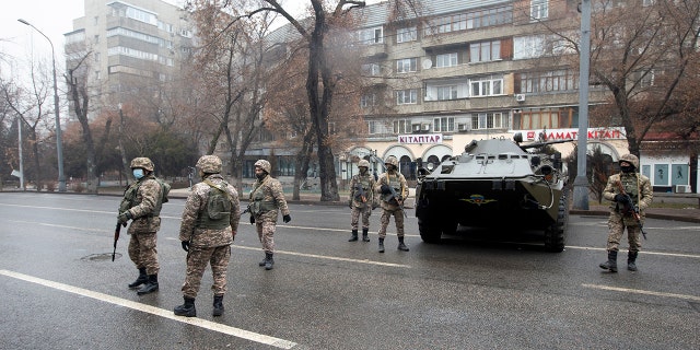 Kazakhstan soldiers patrol a street after clashes in Almaty, Kazakhstan, Friday, Jan. 7, 2022. (Associated Press)
