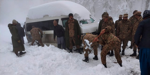 Army troops are participating in a rescue operation in an area affected by heavy snowfall in Murree, about 45 kilometers north of the capital of Islamabad, Pakistan, on Saturday, January 8, 2022 (Inter Services Public Relations via AP)