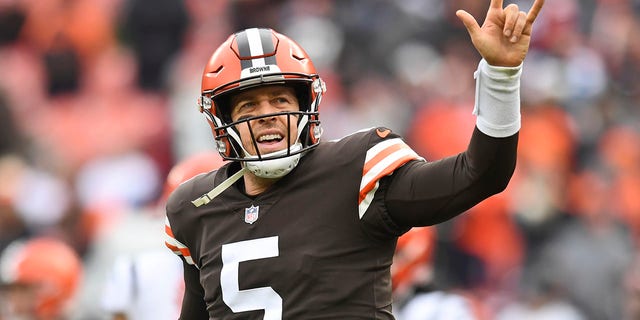 Cleveland Browns quarterback Case Keenum celebrates after a 26-yard touchdown pass to wide receiver Jarvis Landry (80) during the first half of an NFL football game against the Cincinnati Bengals, Sunday, Jan. 9, 2022, in Cleveland.