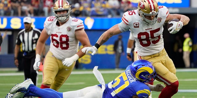 Los Angeles Rams inside linebacker Troy Reeder tackles San Francisco 49ers tight end George Kittle Jan. 9, 2022, in Inglewood, California.