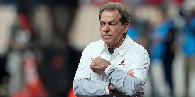 Alabama head coach Nick Saban watches warm ups before the College Football Playoff championship football game against Georgia Monday, Jan. 10, 2022, in Indianapolis. (AP Photo/Paul Sancya)