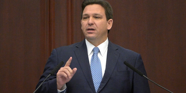 Florida Gov. Ron DeSantis addresses a joint session of a legislative session, Tuesday, Jan. 11, 2022, in Tallahassee, Fla. (AP Photo/Phelan M. Ebenhack)