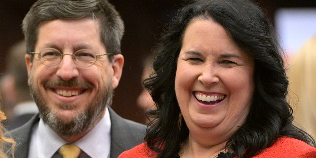 Florida state Sen. Kelli Stargel, right, shares a laugh with her husband John Stargel during a legislative session, Tuesday, Jan. 11, 2022, in Tallahassee, Florida.