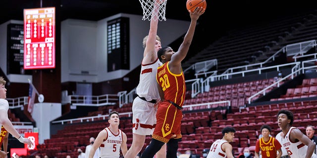Stanford forward James Keefe ( 22 ) defends as Southern California guard Ethan Anderson ( 20 ) aims for the basket during the first half of an NCAA college basketball game Tuesday, Jan. 11, 2022, in Stanford, Calif.