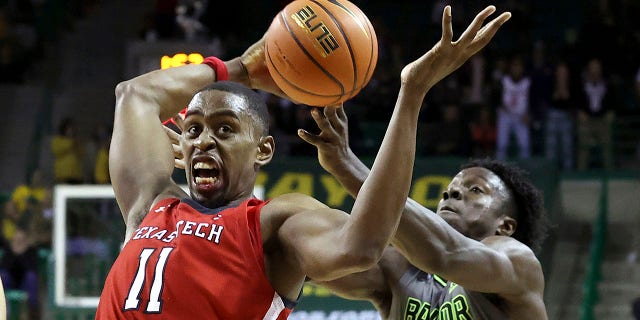 No. 19 Texas Tech Taking Down Top 10s With Senior Transfers - Fox News 2 CORRECTS ID TO BAYLOR FORWARD JONATHAN TCHAMWA TCHATCHOUA, RIGHT - Texas Tech forward Bryson Williams, left,, grabs a loose ball from Baylor forward Jonathan Tchamwa Tchatchoua during the second half of an NCAA college basketball game Tuesday, Jan. 11, 2022, in Waco, Texas.