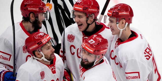 FILE - Russia's Vyacheslav Voynov (27) celebrates with his teammates after scoring his side's second goal during the Channel One Cup ice hockey match between Russia and Finland in Moscow, Russia, Sunday, Dec. 19, 2021. Former Los Angeles Kings defenseman Slava Voynov and the Russians are favored once again at the Olympics without NHL players. Voynov was part of the "Olympic Athletes from Russia" team that won gold in 2018 in Pyeongchang.