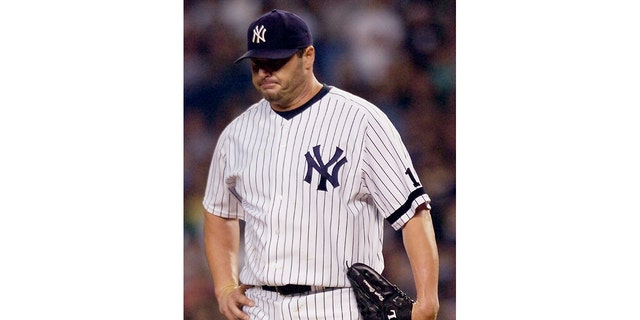 New York Yankees pitcher Roger Clemens reacts after giving up a home run to the Cleveland Indians' Trot Nixon in the second inning during Game 3 of an American League baseball division playoff series Oct. 7, 2007, at Yankee Stadium in New York.